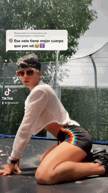 a man is kneeling on a trampoline with a speech bubble that says tik tok
