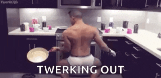 a shirtless man is twerking in the kitchen while holding a pan .