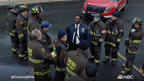 a group of firefighters are standing in a circle with chicago fire dept written on their uniforms