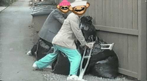 a woman with crutches is being pushed by a man with monkey faces on his face