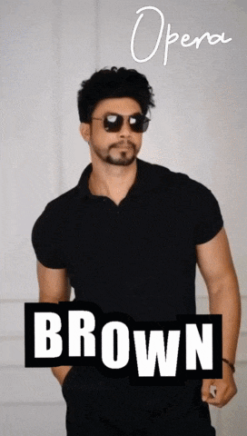 a man wearing sunglasses and a black shirt stands in front of a sign that says opera brown