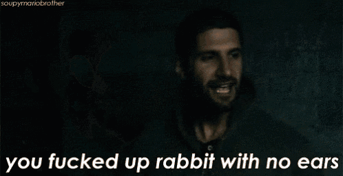 a man with a beard is talking to another man with the words " you fucked up rabbit with no ears "