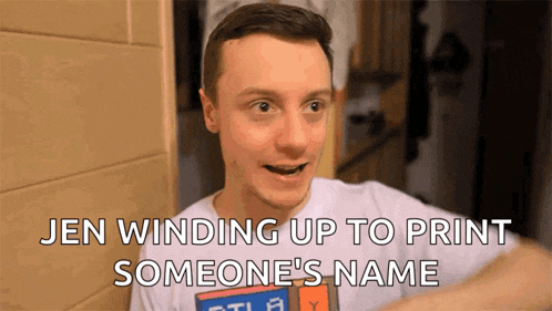 a man in a white shirt with the words jen winding up to print someone 's name on the bottom