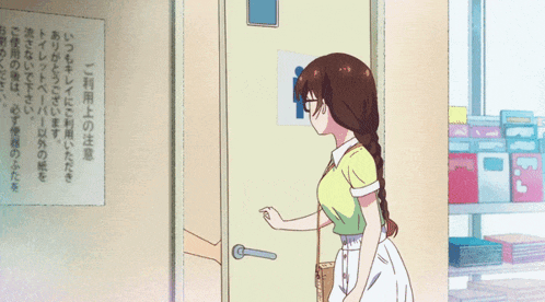 a woman is standing in front of a door with a sign on it that says ' men 's and women 's '