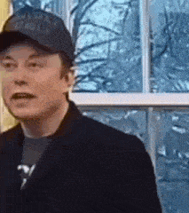 elon musk is wearing a black hat and a black jacket .