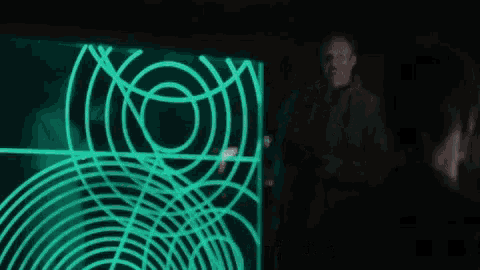 a man is standing in front of a screen that says welcome to the sylo server