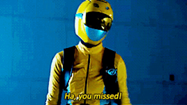 a man wearing a yellow helmet and a yellow jacket says ha you missed