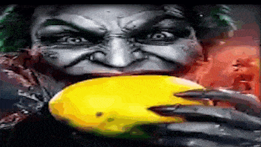 a close up of a joker eating a pac man