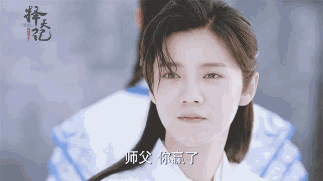 a woman with chinese writing on her face is looking at the camera