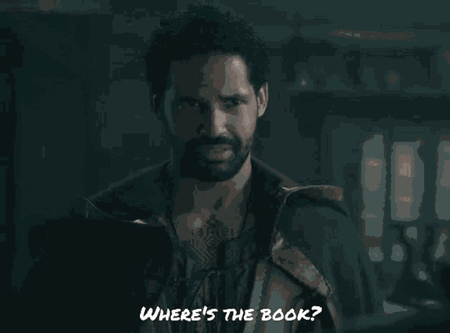a man with a beard is asking where 's the book .