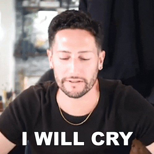 a man with a beard wearing a black shirt and a gold chain says " i will cry "