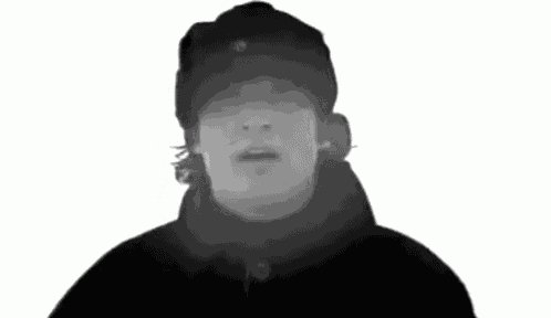a black and white photo of a man with a hat on