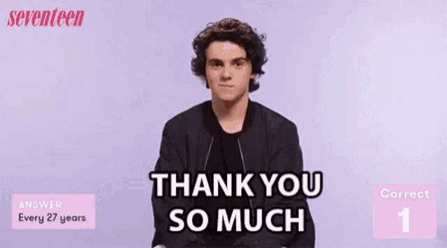 a young man is giving a thank you so much sign .