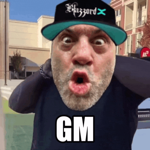 a man with a beard wearing a hat that says blizzard on it