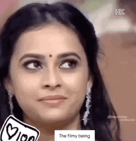 a close up of a woman 's face with a sticker on it that says the filmy being .