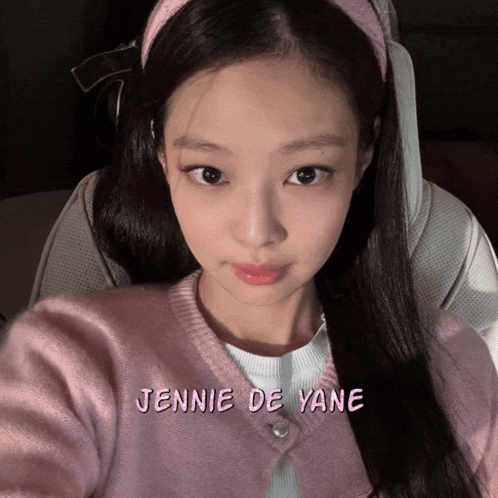 a close up of a woman 's face with the name jennie de yan on it