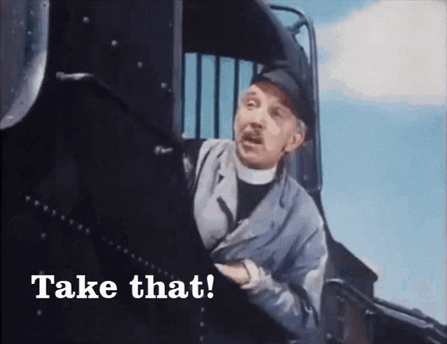 a man on a train with the words take that written below him