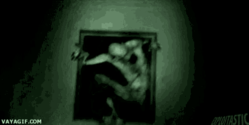 a blurry picture of a person walking through a hole in the wall .