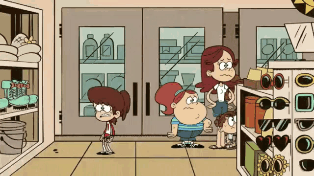a group of three cartoon characters are standing in a store .