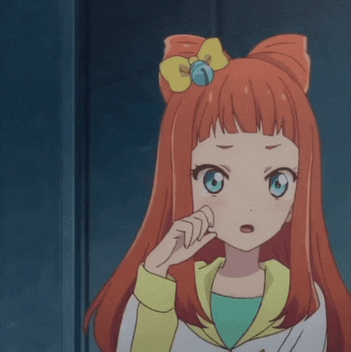 a girl with red hair and blue eyes is wearing a yellow jacket