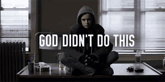 a woman in a hoodie sits at a table with the words god did n't do this above her