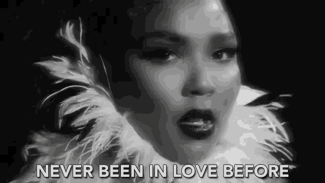 a black and white photo of a woman with the words never been in love before below her