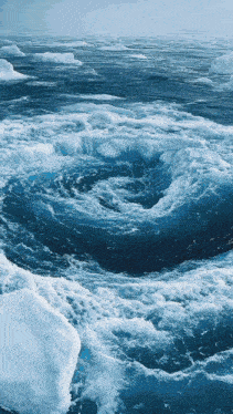 a large body of water with a swirl in the middle of it