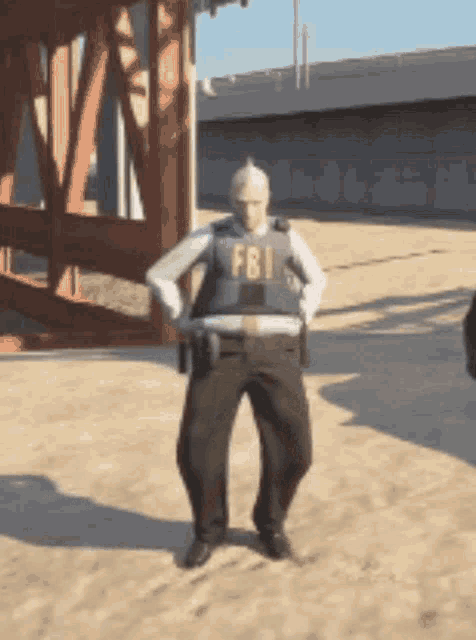 a man in a fbi vest is standing in the dirt