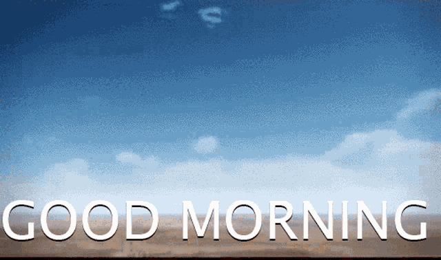 a blue sky with clouds and the words good morning in white