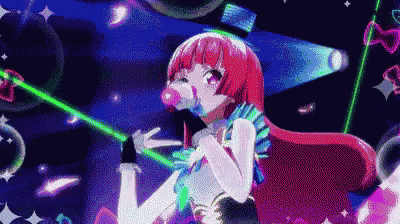 a girl with red hair is blowing bubbles in the air while holding a green light .