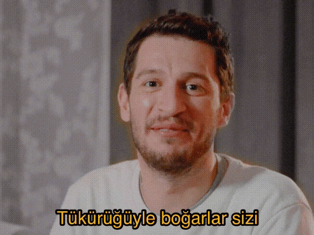 a man with a beard is smiling with a caption that says " tukuruguyle bogarlar sizi "