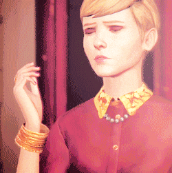 a pixelated image of a woman wearing a red shirt with a yellow collar