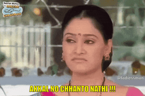 a woman in a pink top says akkal no chhanto nathi !!!