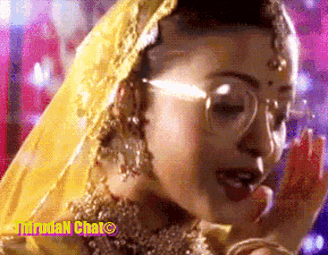 a close up of a woman wearing glasses and a yellow veil with a purple background