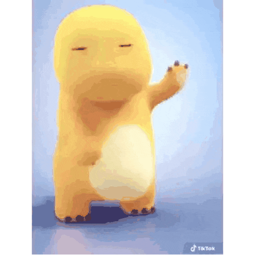 a yellow cartoon character is standing on a blue surface and waving at the camera .