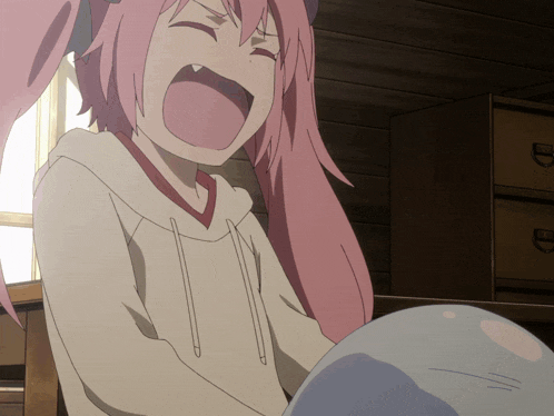 a girl with pink hair and a white hoodie is screaming