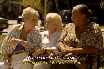 three women are sitting on a bench and one of them says " i happen to think she 's a snob "