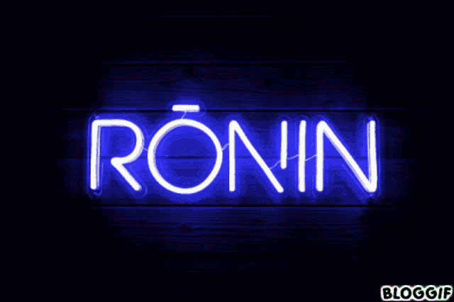 a neon sign that says ronin on a wooden wall