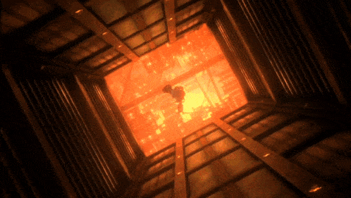a person is standing in a dark room with a glowing orange light behind them