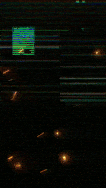 a blurry picture of a blue and green striped background with a few sparks coming out of it .