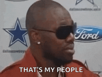 a man wearing sunglasses is standing in front of a ford logo and says `` that 's my people '' .