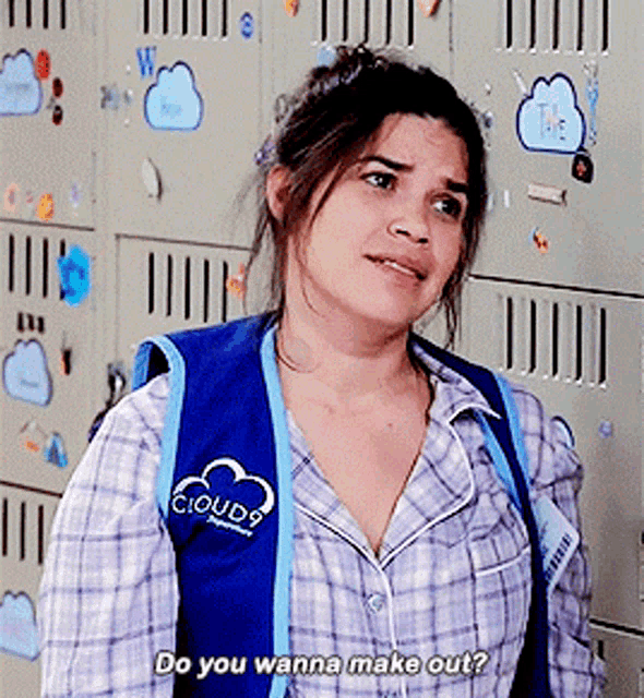 a woman wearing a blue vest that says cloud9 on the front