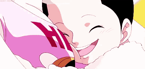 a close up of a cartoon character 's face with the letter h on his shirt .
