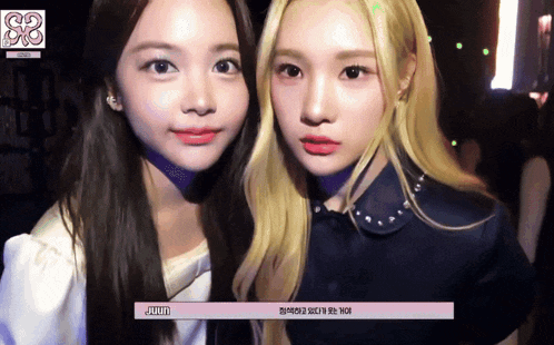 two girls are posing for a picture and one of them has the word jimin on the bottom right corner