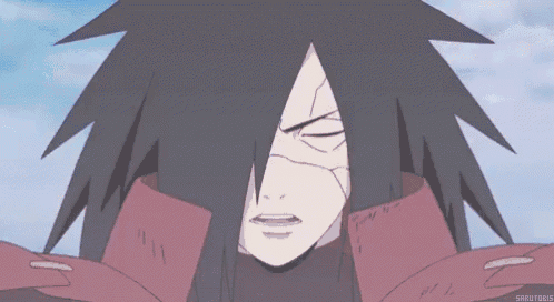 a close up of a cartoon character with a very long hair and a red cape .