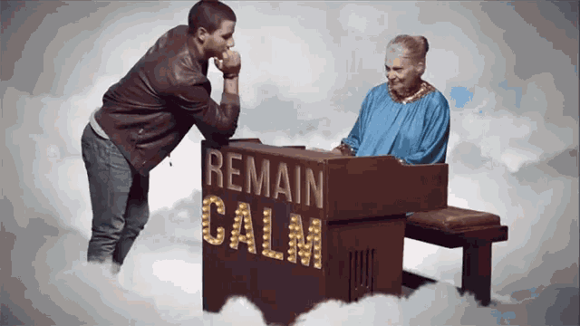 a man stands next to an elderly woman playing a piano that says " remain calm "