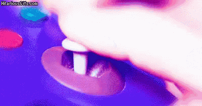 a close up of a person 's mouth with a purple background and a button in it .