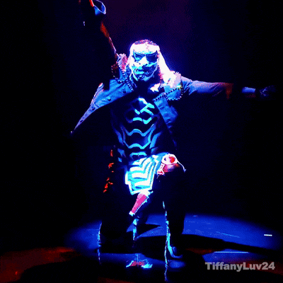 a man in a costume with flames coming out of his arms with tiffanyluv24 in the corner
