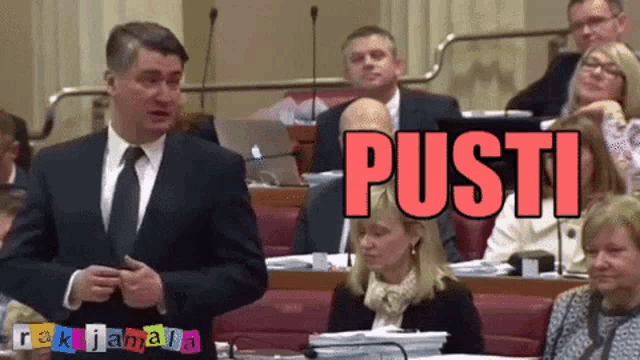 a man in a suit and tie stands in front of a group of people with the word " pusti " on the bottom