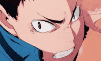 a close up of a man 's face with a very angry expression .